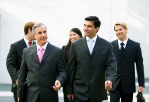 Business executives walking and talking together